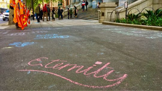 Example: Eternity written in chalk. Parliament in background.