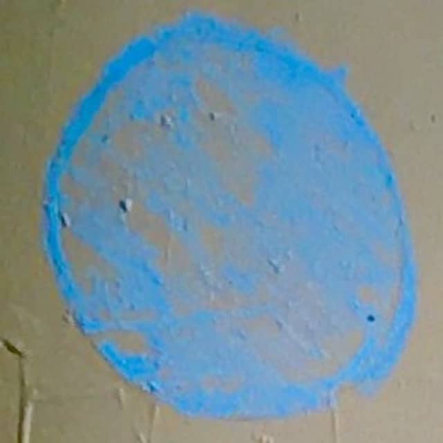 scrawled blue chalk dots