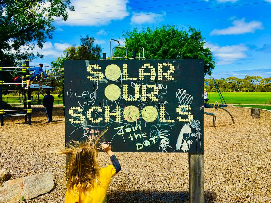 Example: 'Solar Our Schools' in Chalk, child chalking